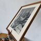 Framed old photo of a mountain landscape.