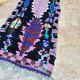 Vintage Berber Boucherouite hallway rug: Handwoven Moroccan rug.