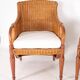 Pair of wooden and wicker armchairs