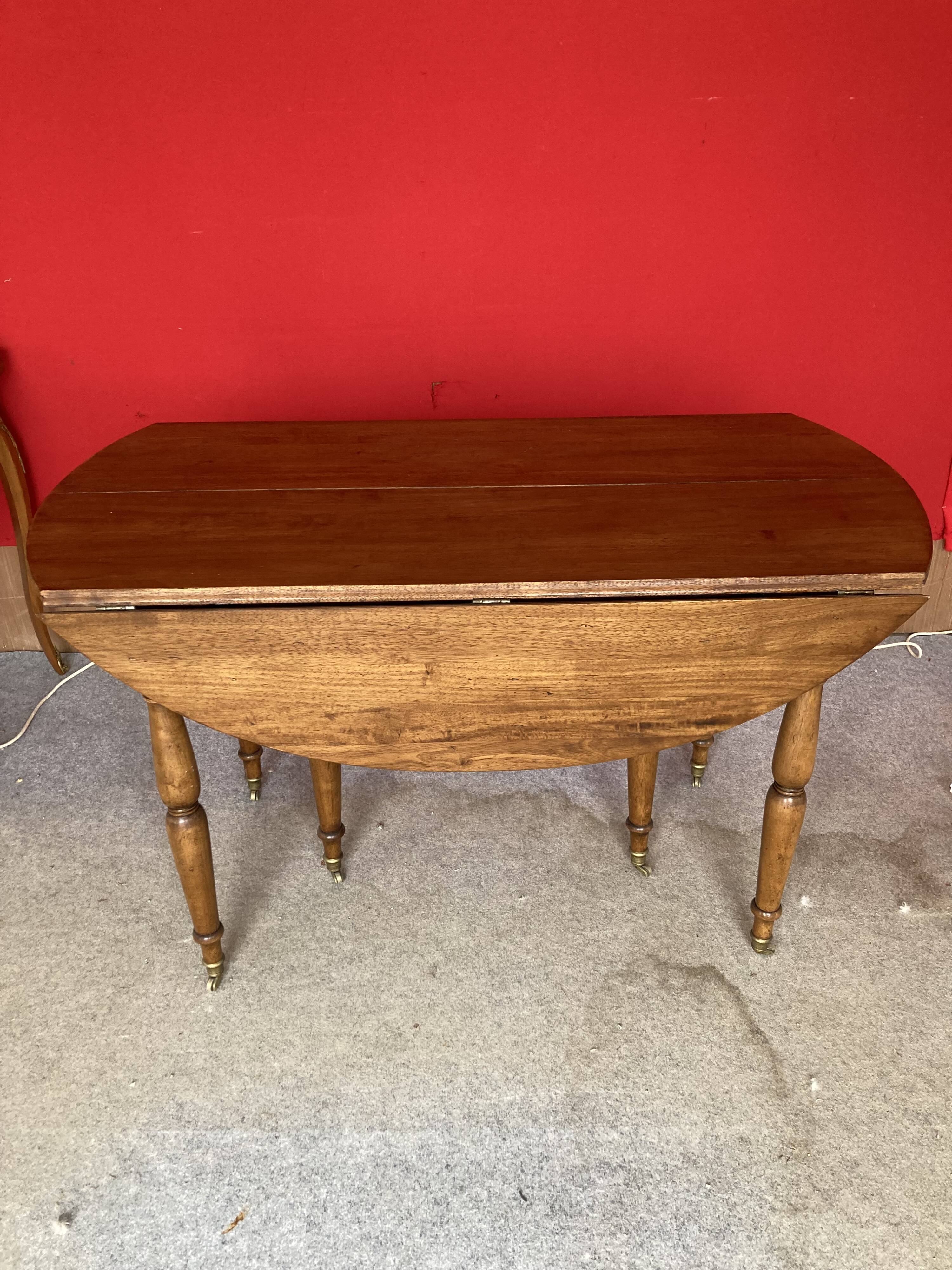 Cherry wood drop-leaf table.