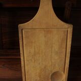 Wood cutting board with groove and handle