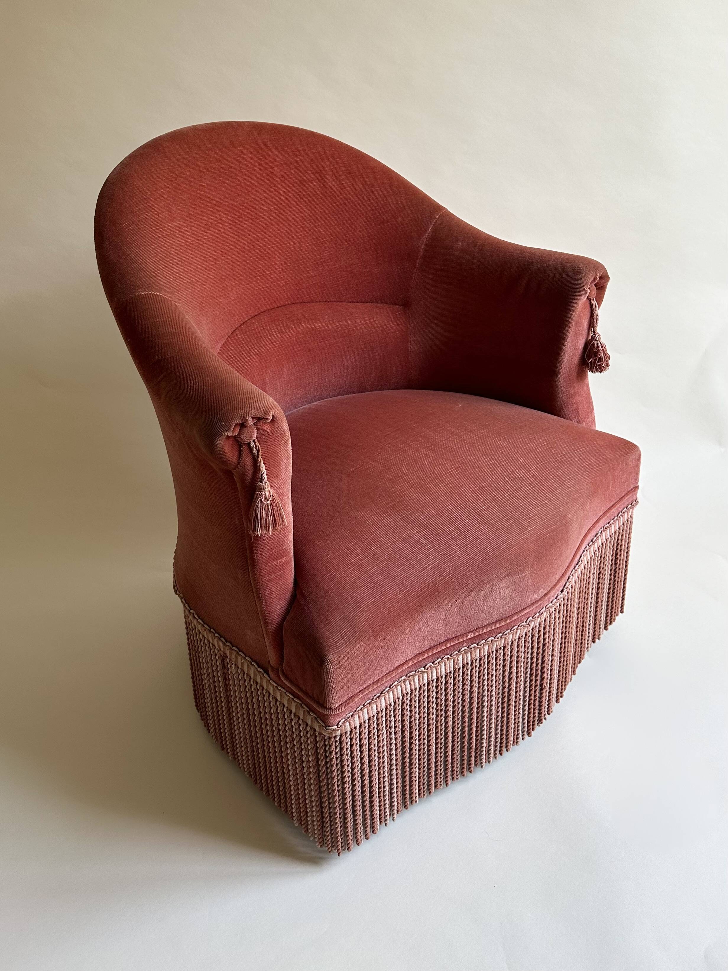Pink-orange velvet tub chair