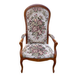 Louis XV Voltaire armchair in solid wood and floral fabric.
