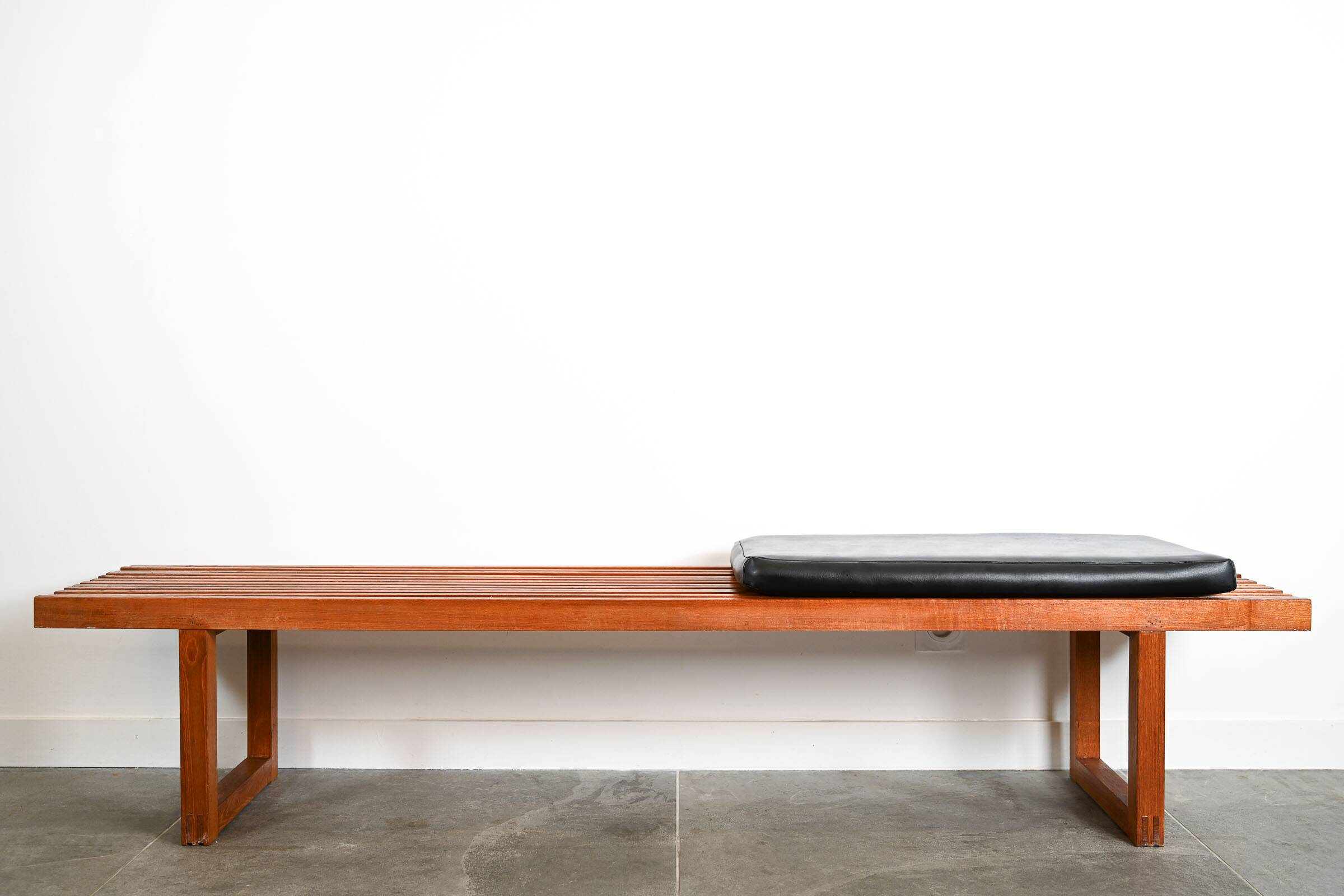 Teak bench with black leatherette seat cushion Origin Denmark years