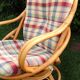 Swivel rattan armchair with matching ottoman