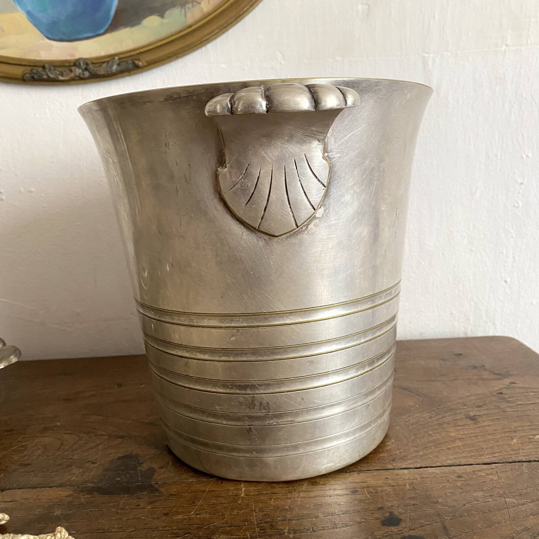 Antique champagne bucket with shell handles.