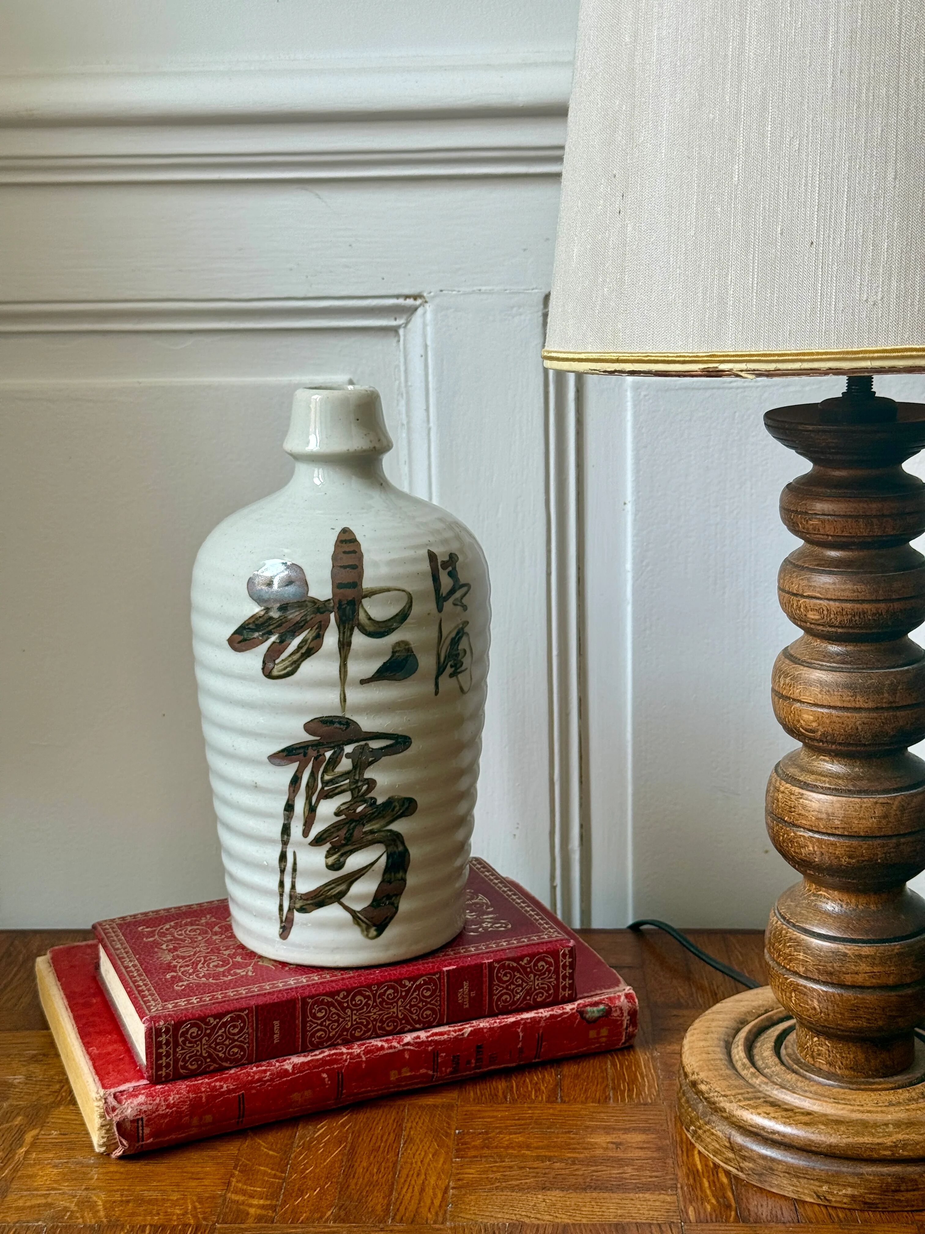 Old Japanese sake bottle in tokkuri shape.