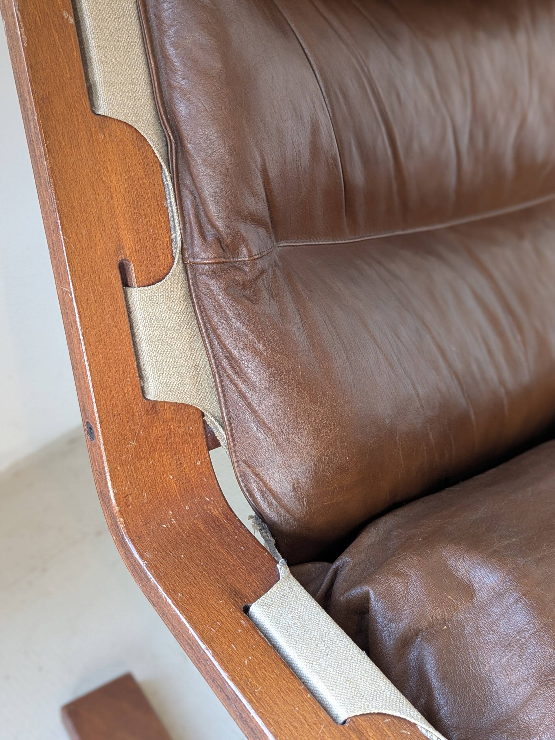 Leather and wood armchair, brutalist style.