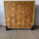 Bar cabinet with chevron installation