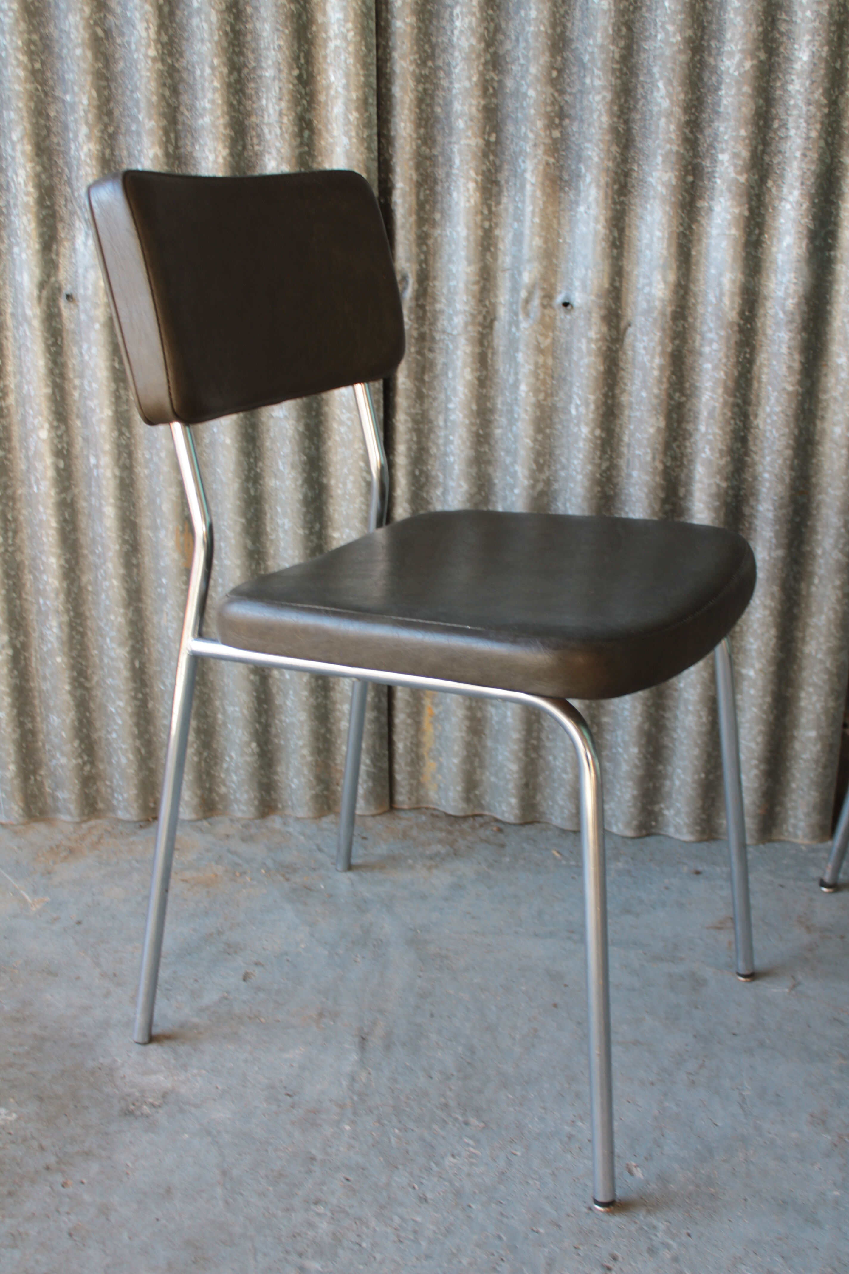 3 bronze-green faux leather chairs with chrome frames