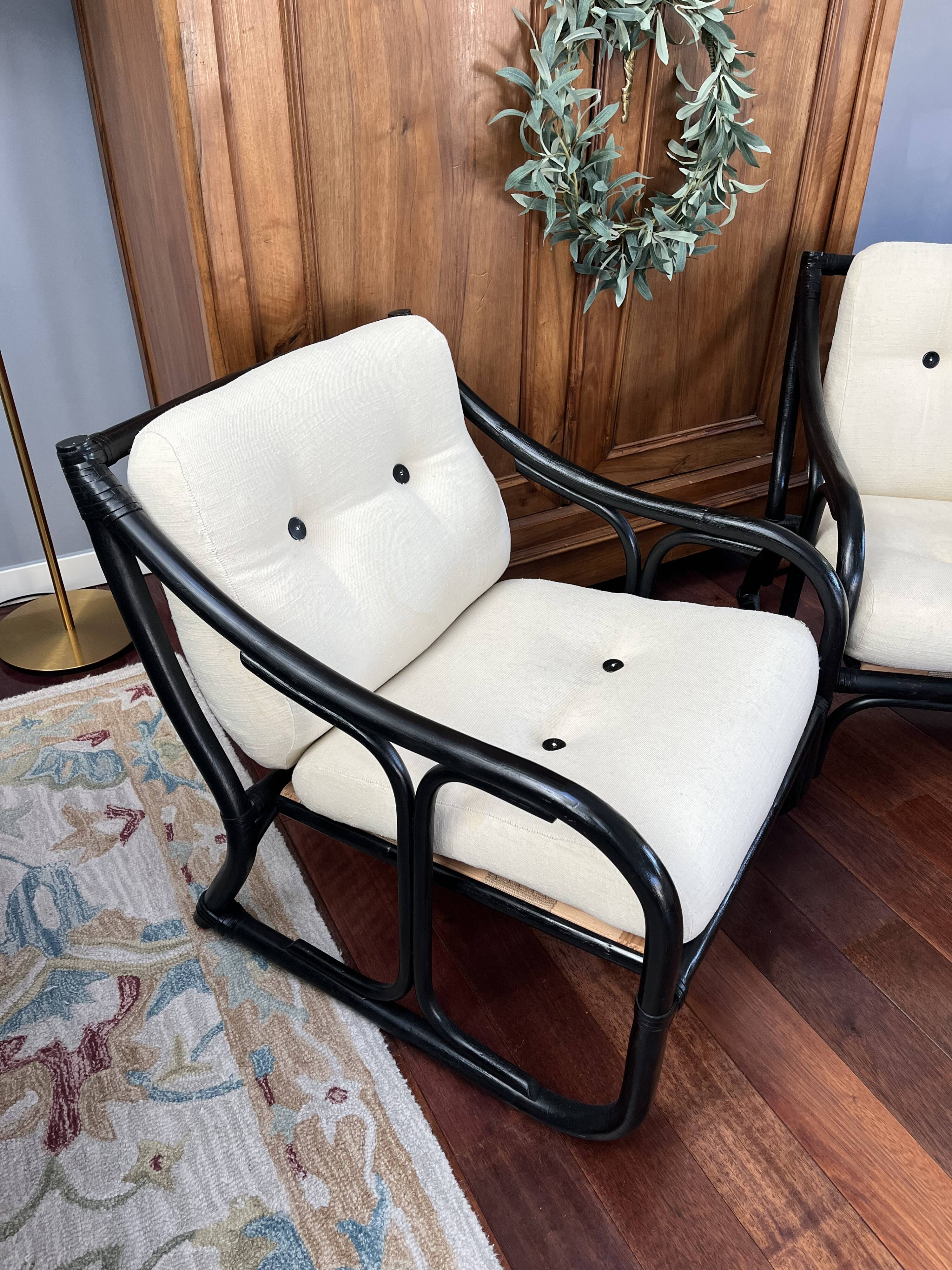 Set of two vintage black and white bamboo chairs.
