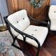 Set of two vintage black and white bamboo chairs.