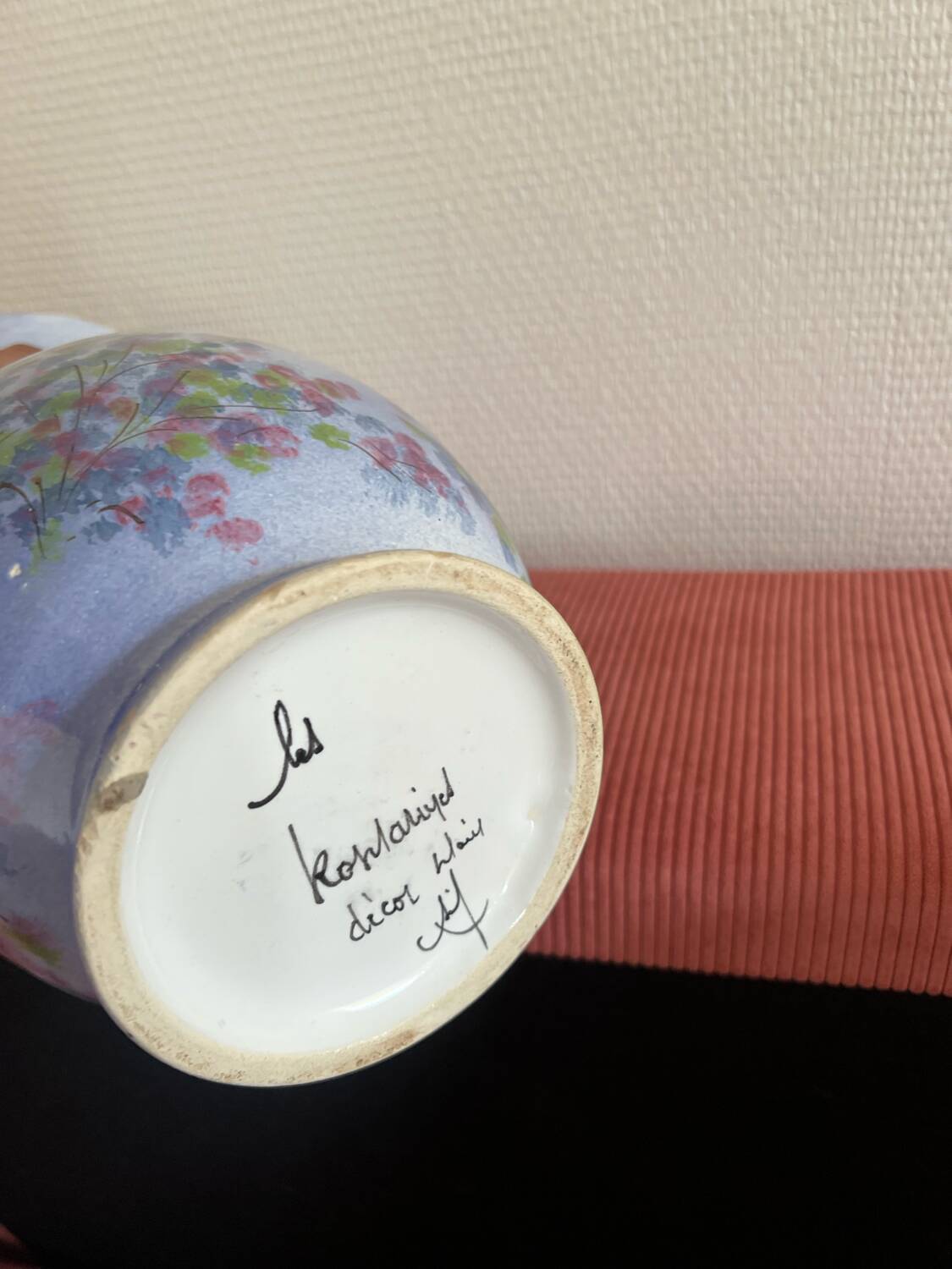 Large blue vase with pastel flowers