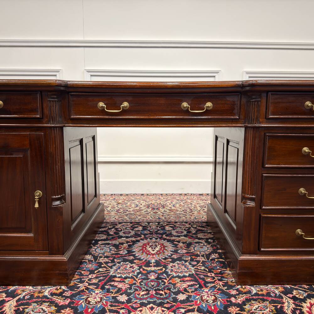 Classic English desk with green leather inlay.