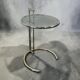 Vintage adjustable chrome side table with smoked glass.