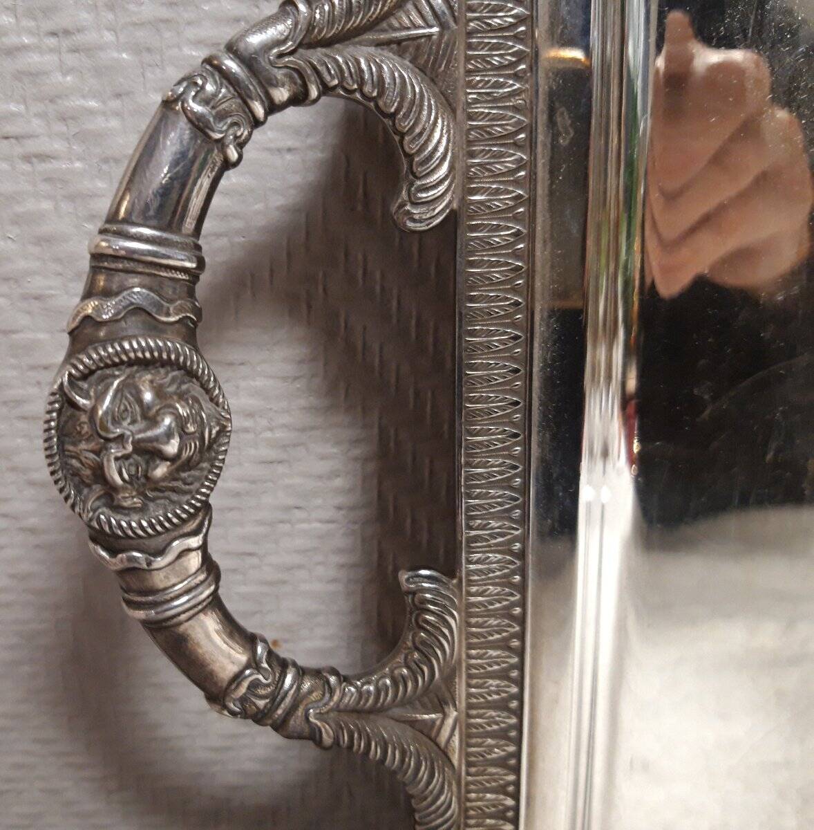 Silver-plated service tray with handles, neoclassical decoration.