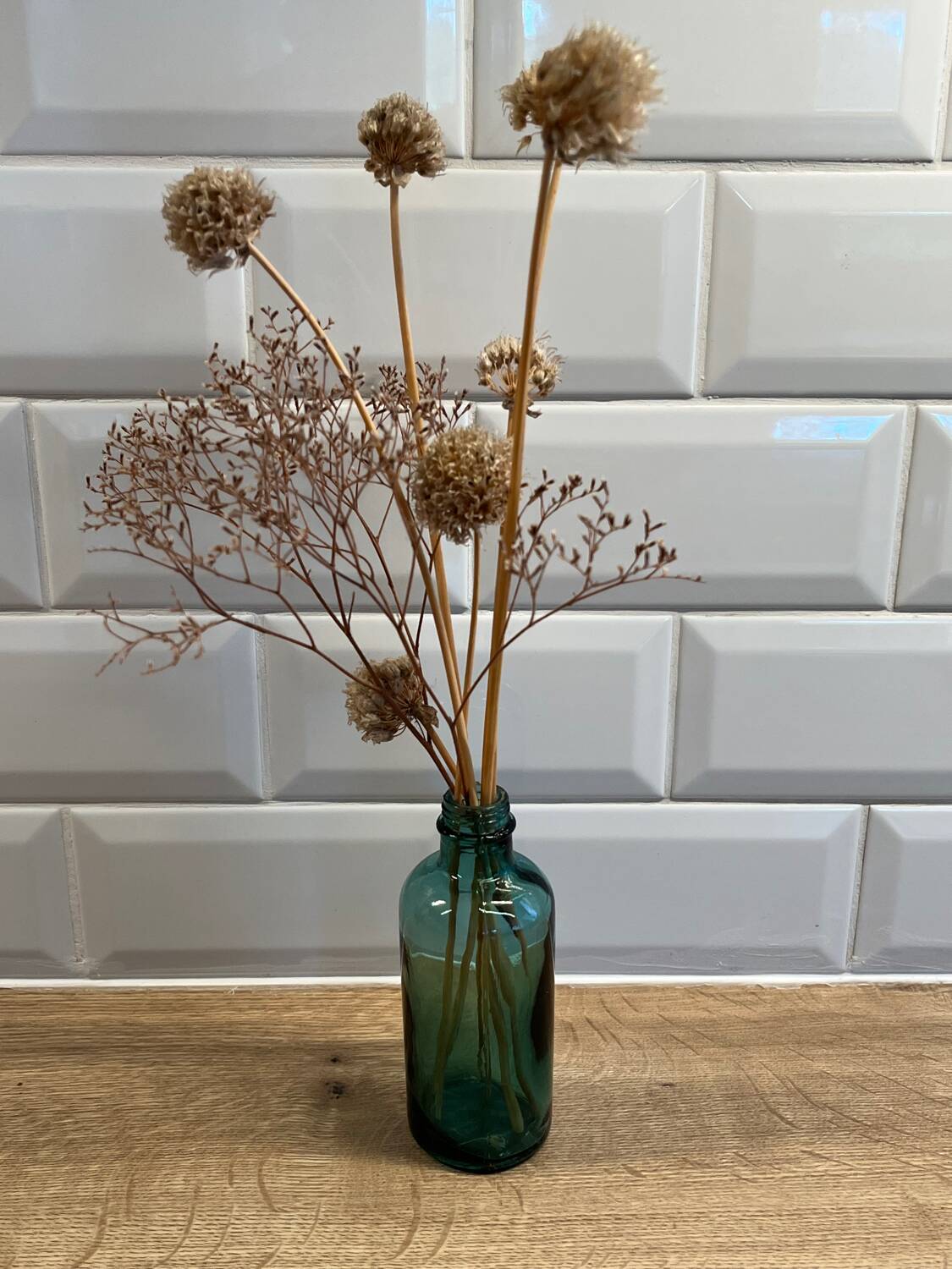 Small vintage dark turquoise blue bottle