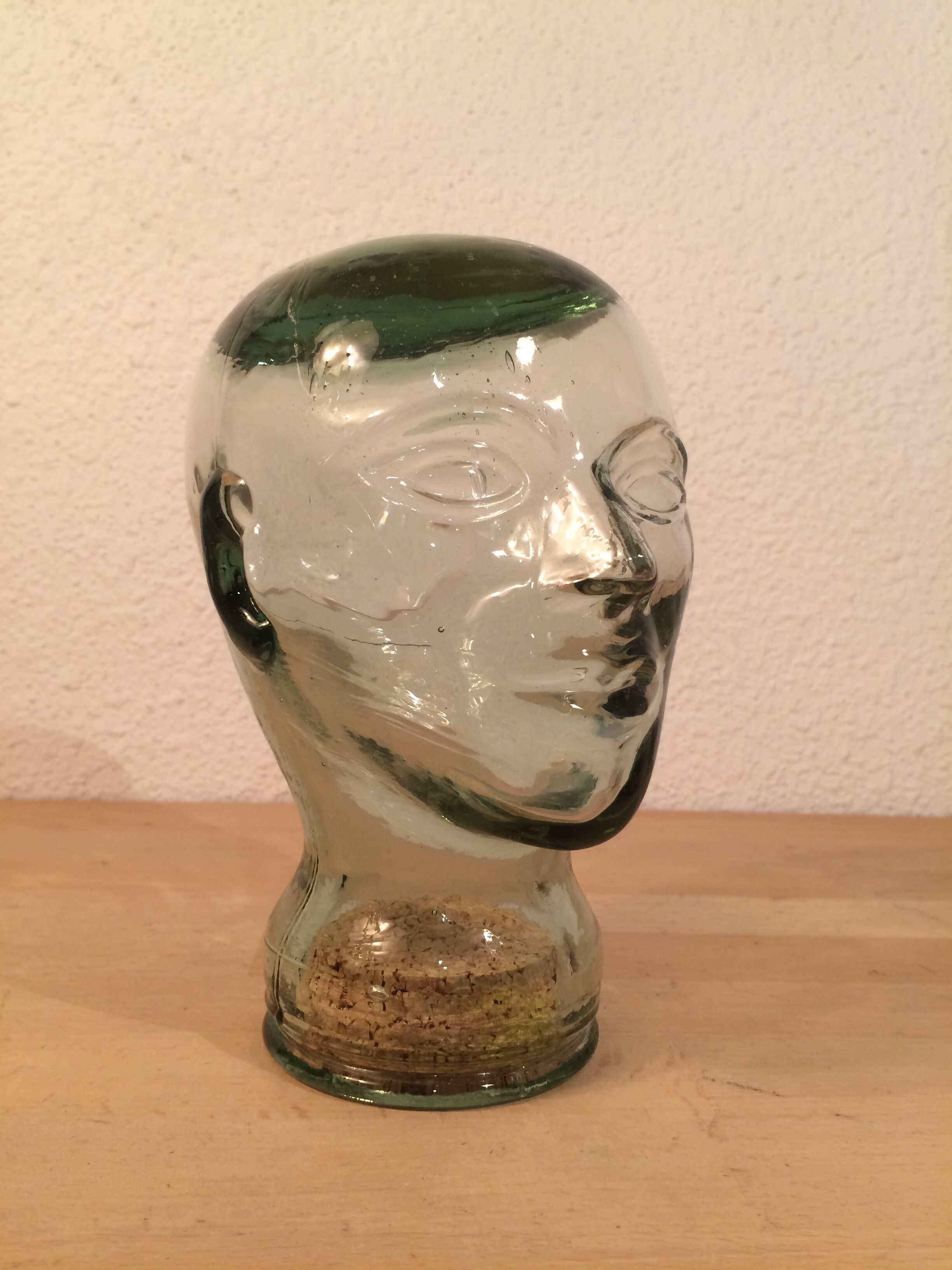 Molded glass head curiosity cabinet