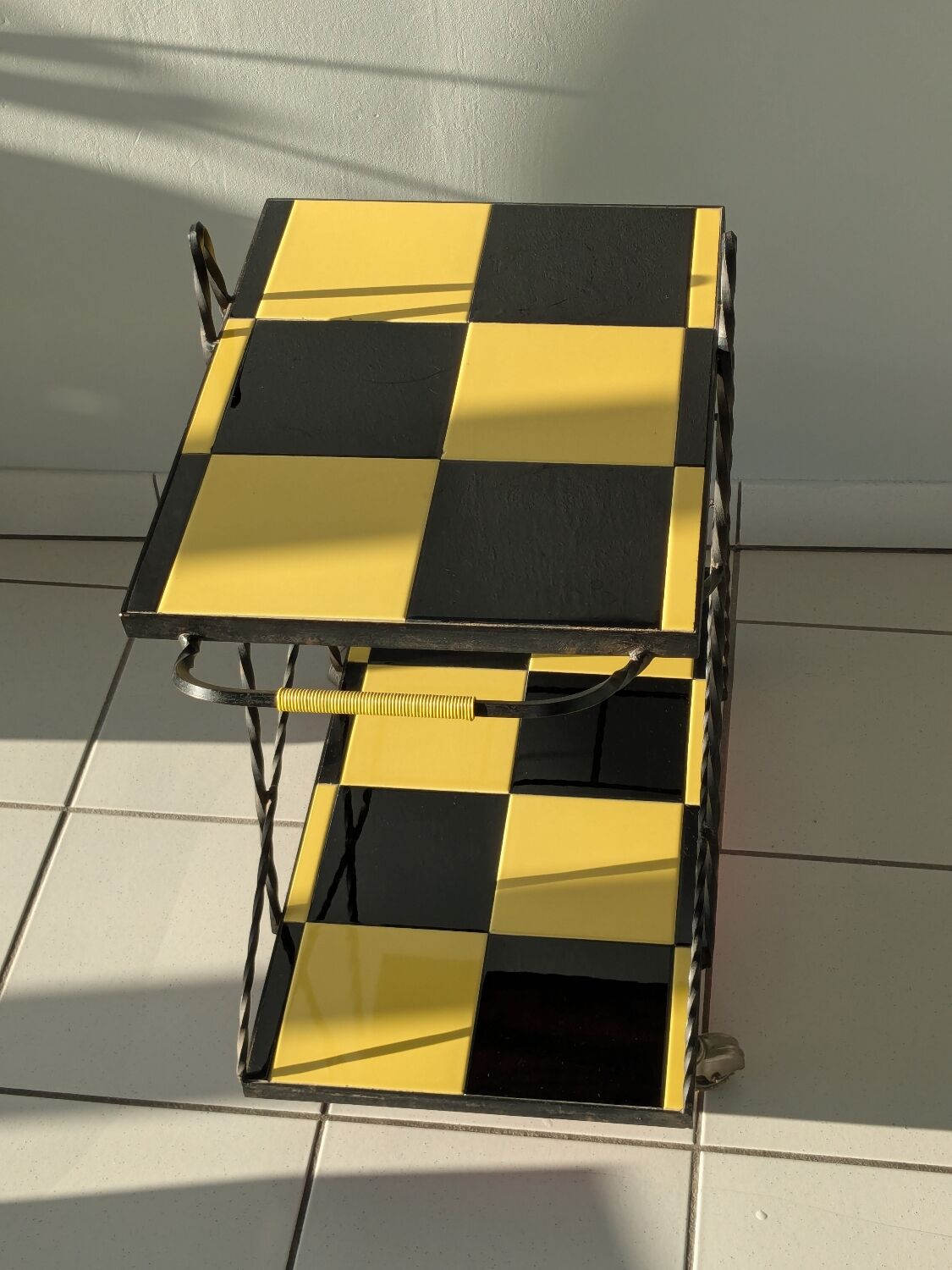 Vintage black and yellow checkered rolling bar trolley