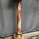 Marble pedestal decorated with gilded brass.