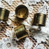 Four rounds of old brass towel around 1930