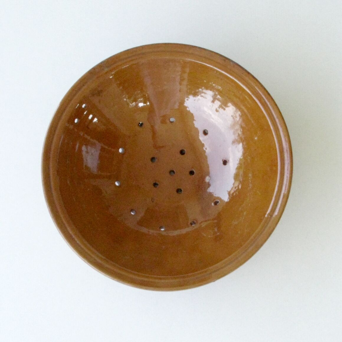 Old drainer dish faisselle in earthenware Varnishing brown