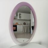 Vintage oval plexiglass mirror from the 70s by Harvey Guzzini