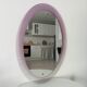 Vintage oval plexiglass mirror from the 70s by Harvey Guzzini