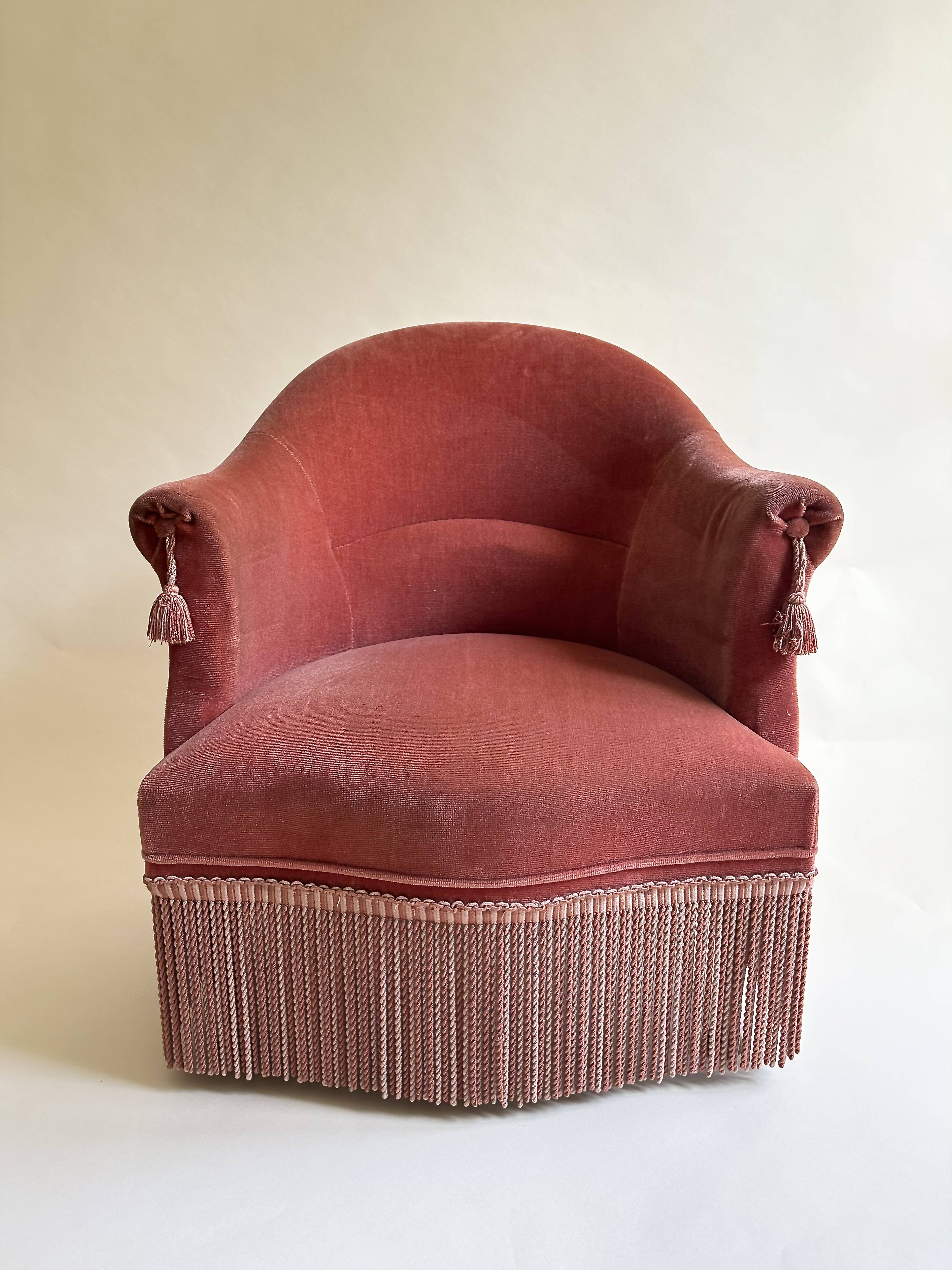 Pink-orange velvet tub chair