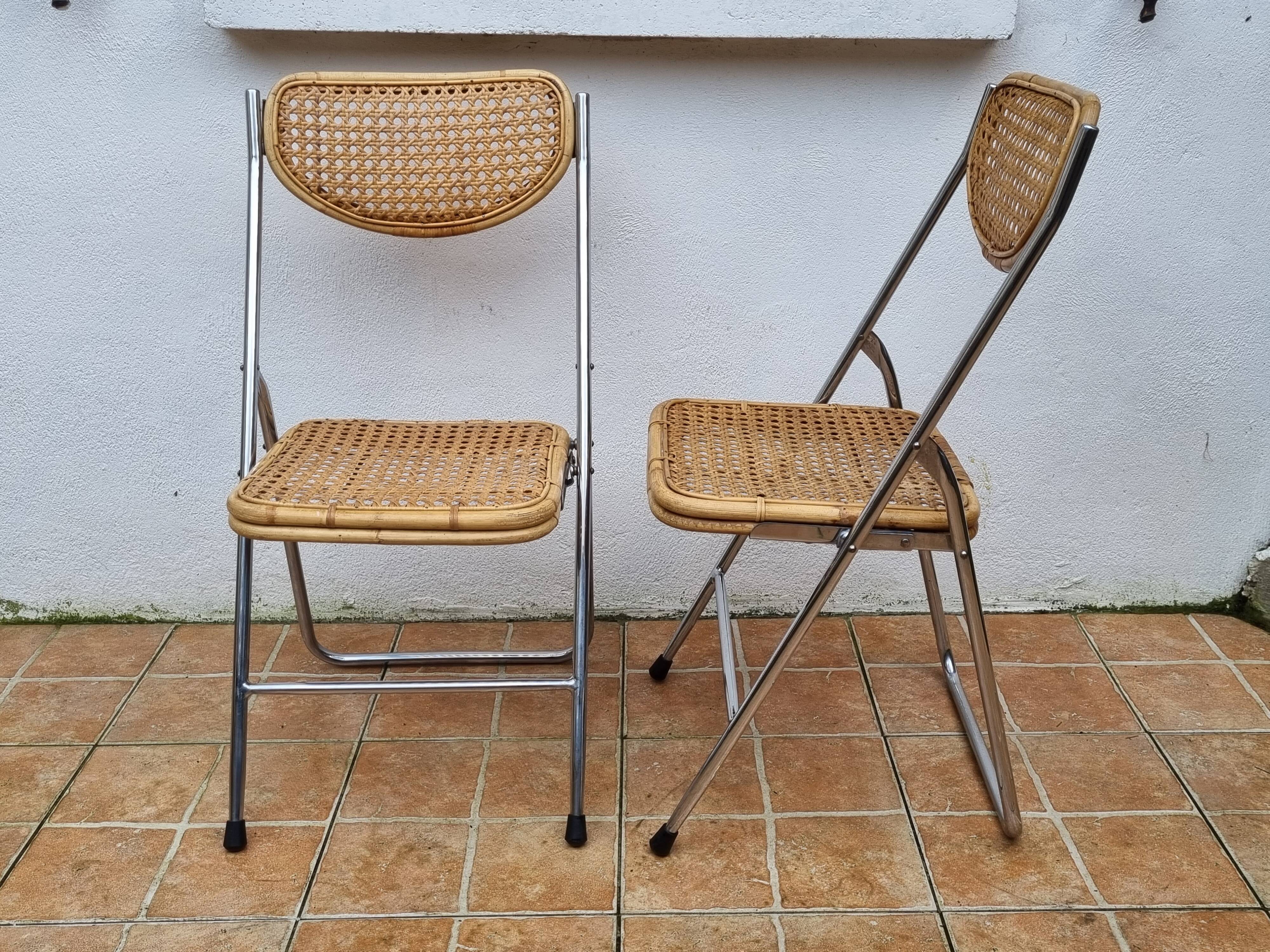 Pair of vintage metal and cane folding chairs