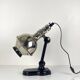 Directional articulated lamp in nickel-plated chrome and black bakelite, with cast iron counterweight.