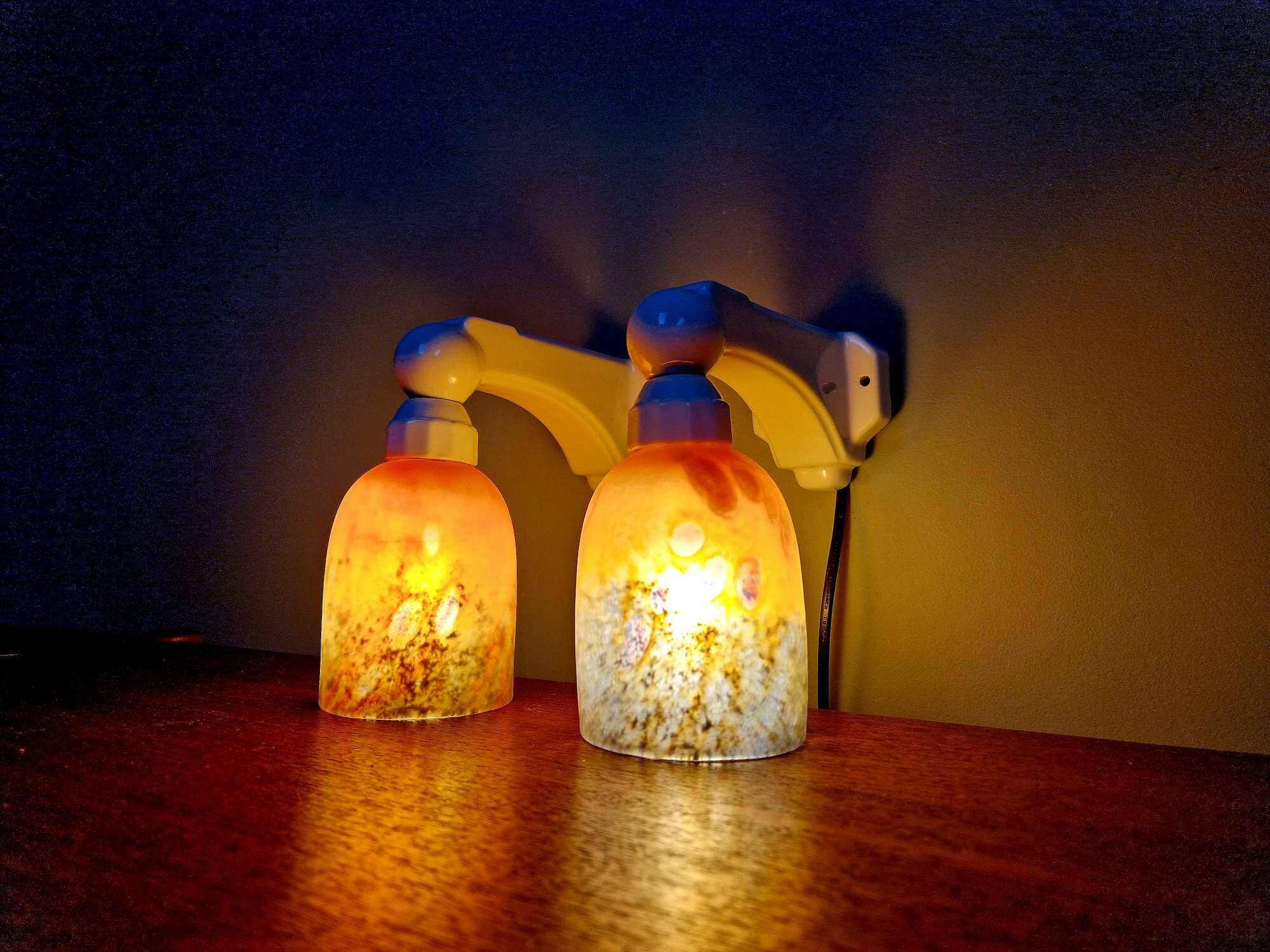 Pair of Art Deco wall sconces in multicoloured porcelain and frosted glass.