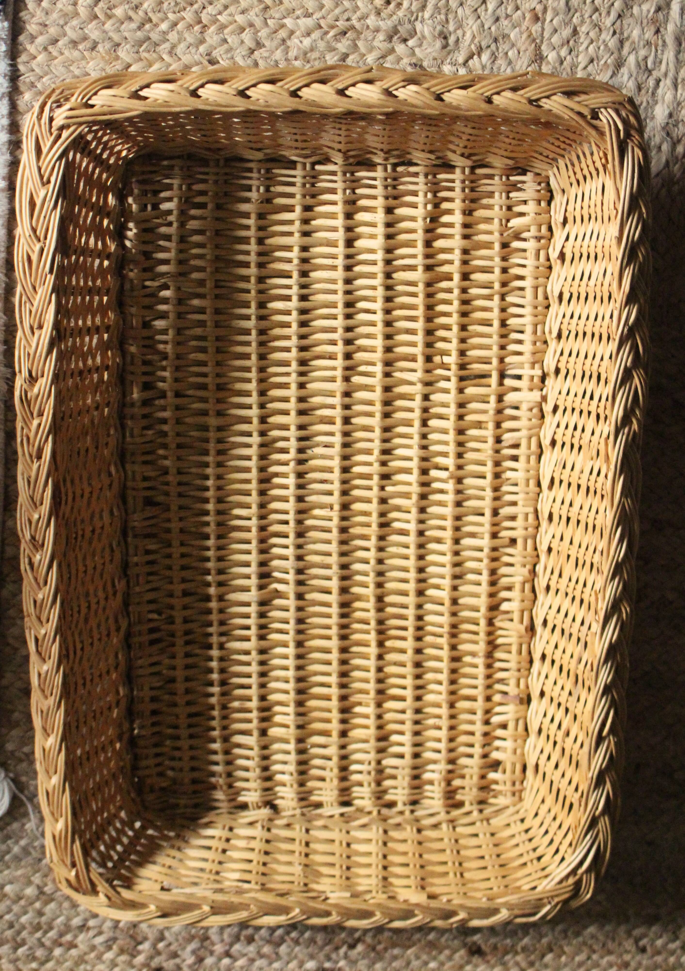 A large vintage rectangular wicker basket