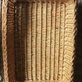 A large vintage rectangular wicker basket
