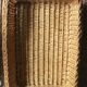 A large vintage rectangular wicker basket