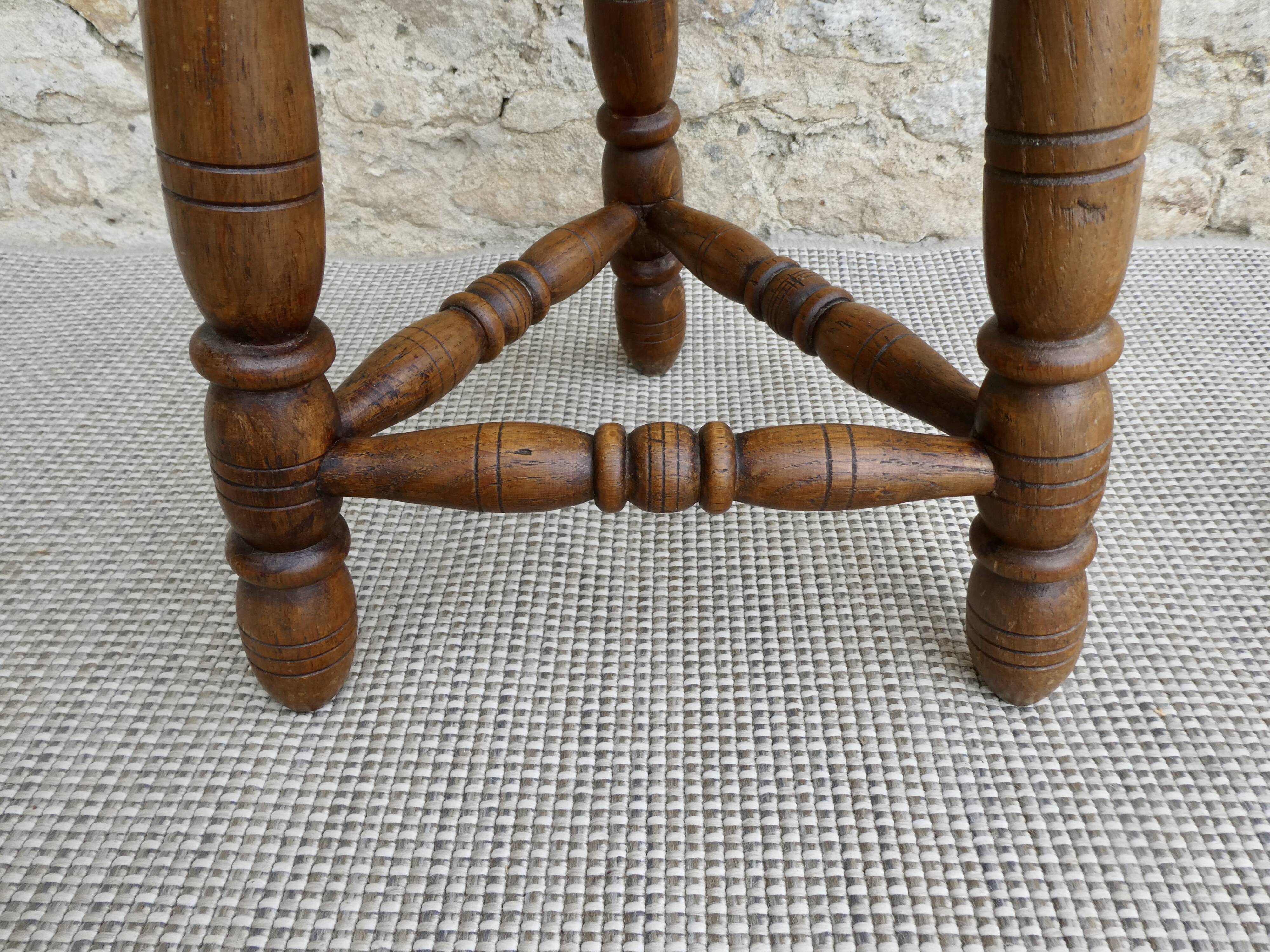 Pair of solid wood tripod stools, carved.