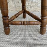 Pair of solid wood tripod stools, carved.