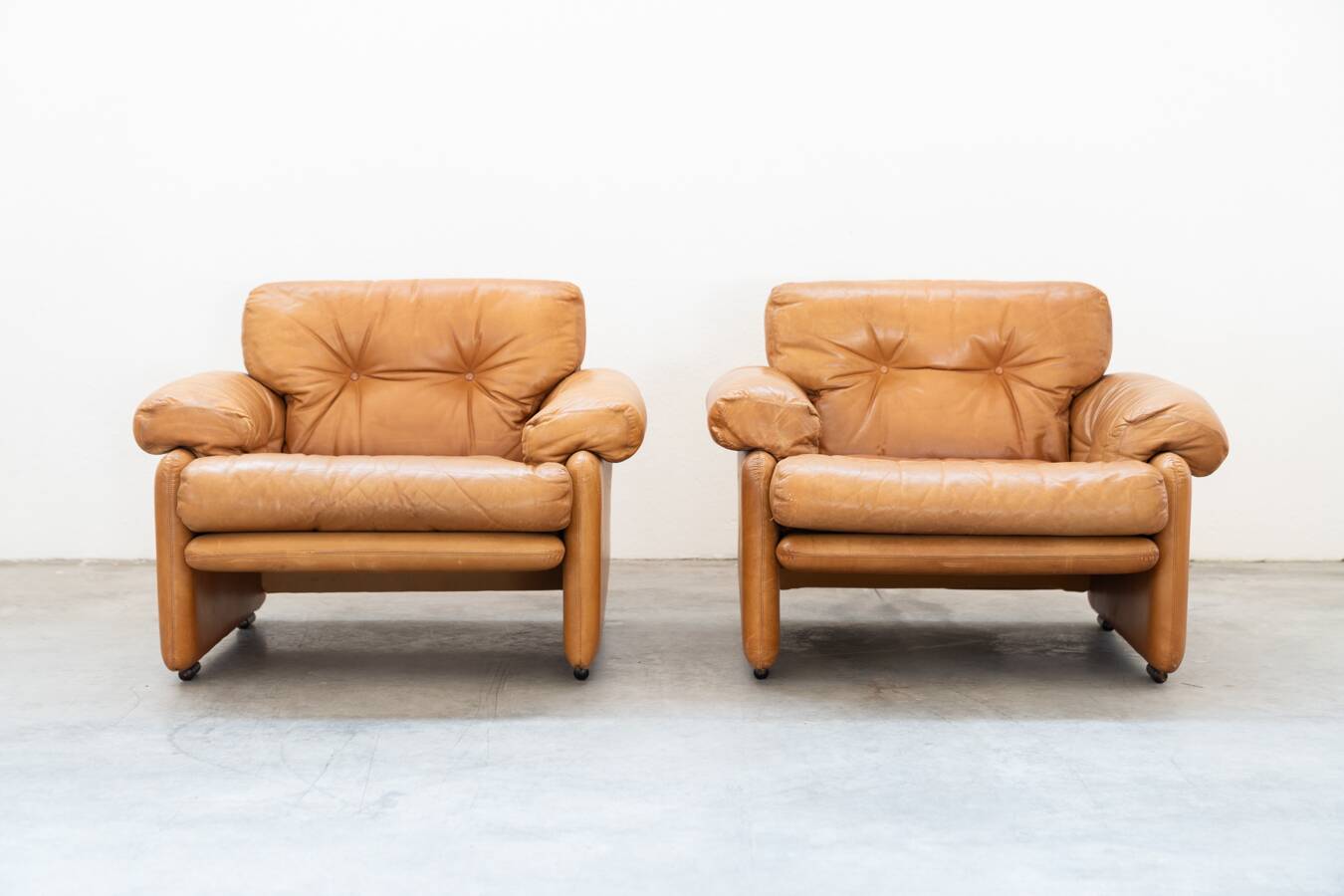 Pair of armchairs with cognac-colored pouf, "Coronado" model by Afra & Tobia scarpa for B&B It