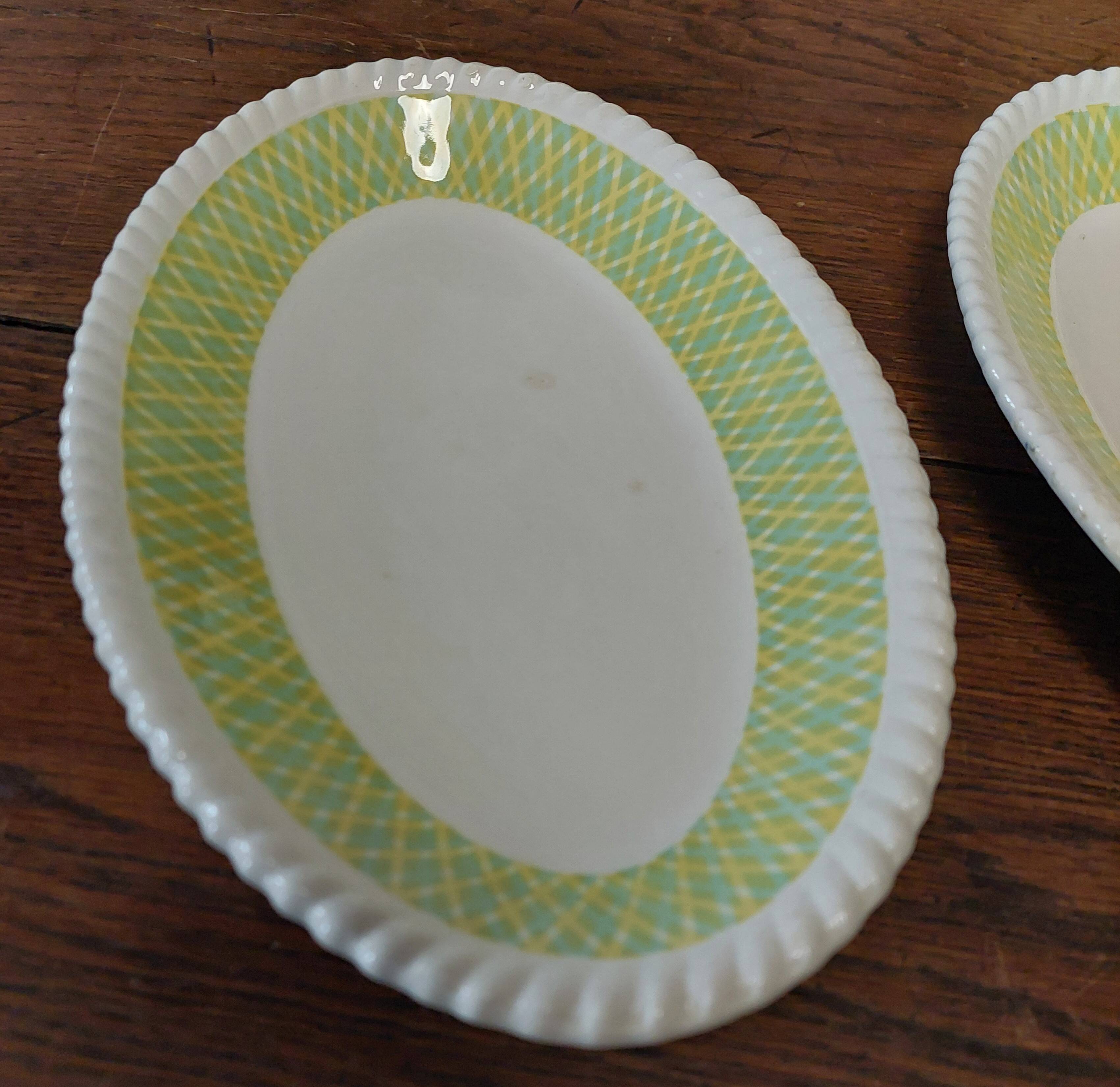 Pair of Badonviller iron earthenware dishes, Amina model