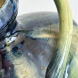 Two-handled ceramic vase with a blue and green gradient pattern.