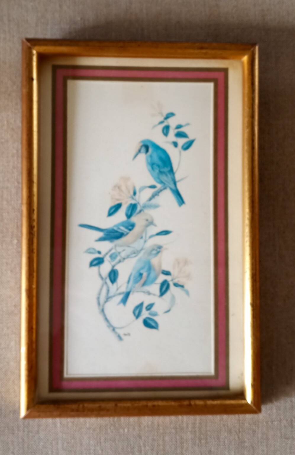 Painting with birds in an old golden frame