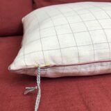 Beige linen cushion with checkered pattern and shiny pink piping