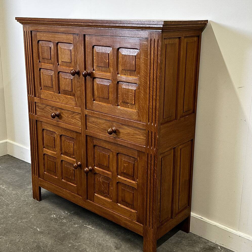 Artisan brutalist oak cabinet with turned knobs, France, 1970s