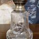 Pair of antique Louis XVI style bottles in finely engraved crystal and silver.