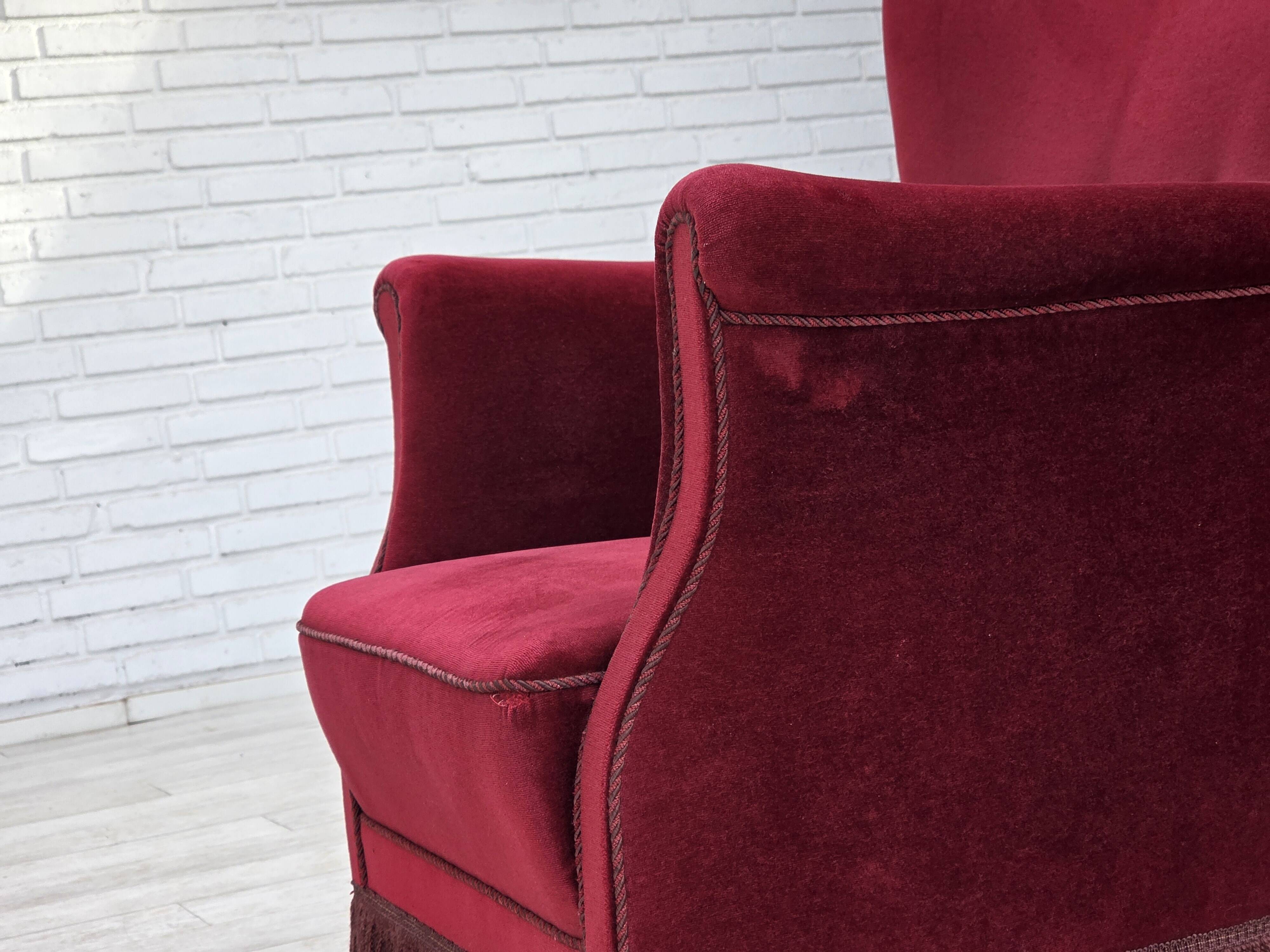 1970s, Danish armchair, cherry-red furniture velour, oak wood legs.