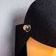 Matte black wall lamps with perforated shades and brass details