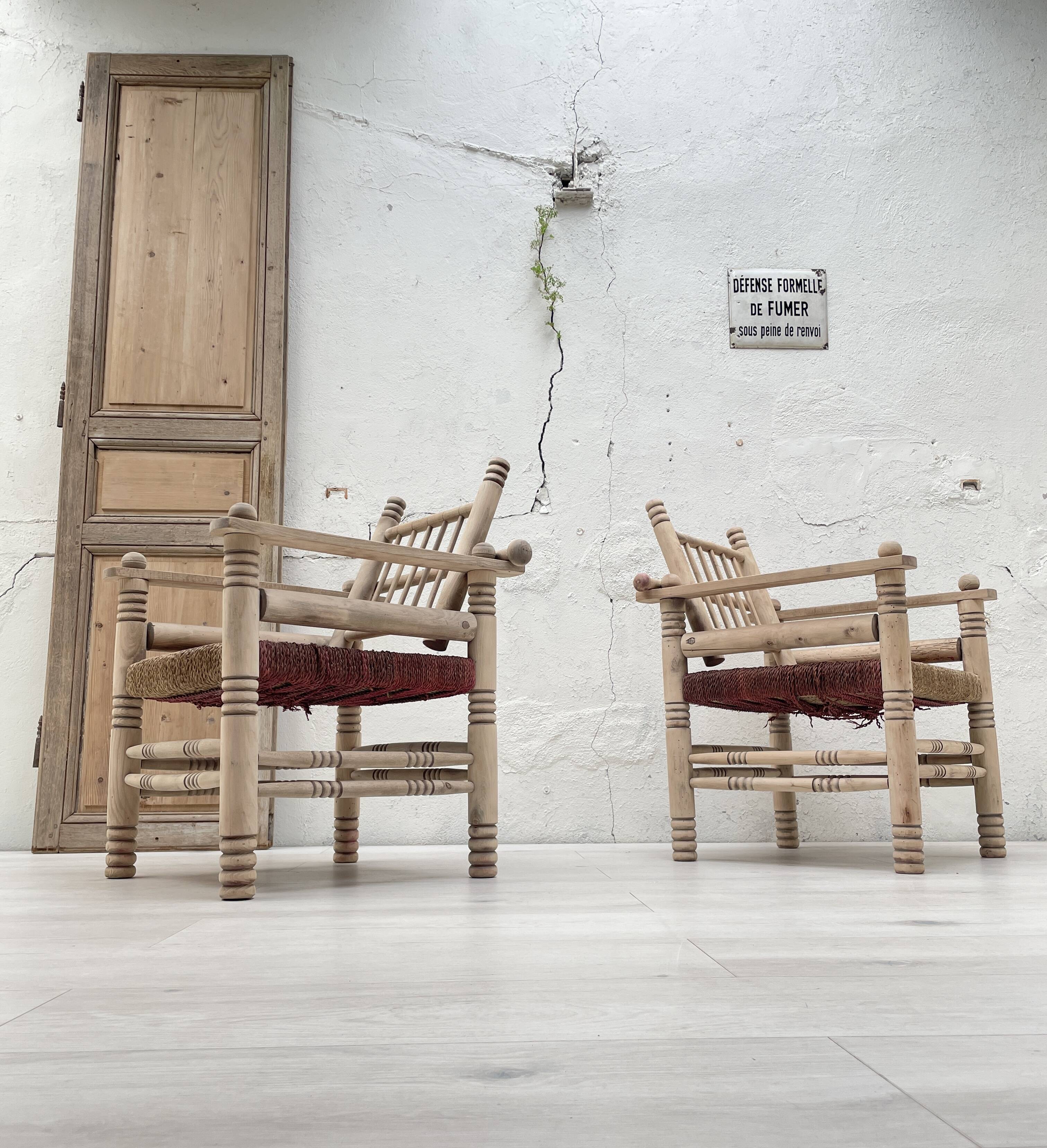 Pair of wooden armchairs and ropes