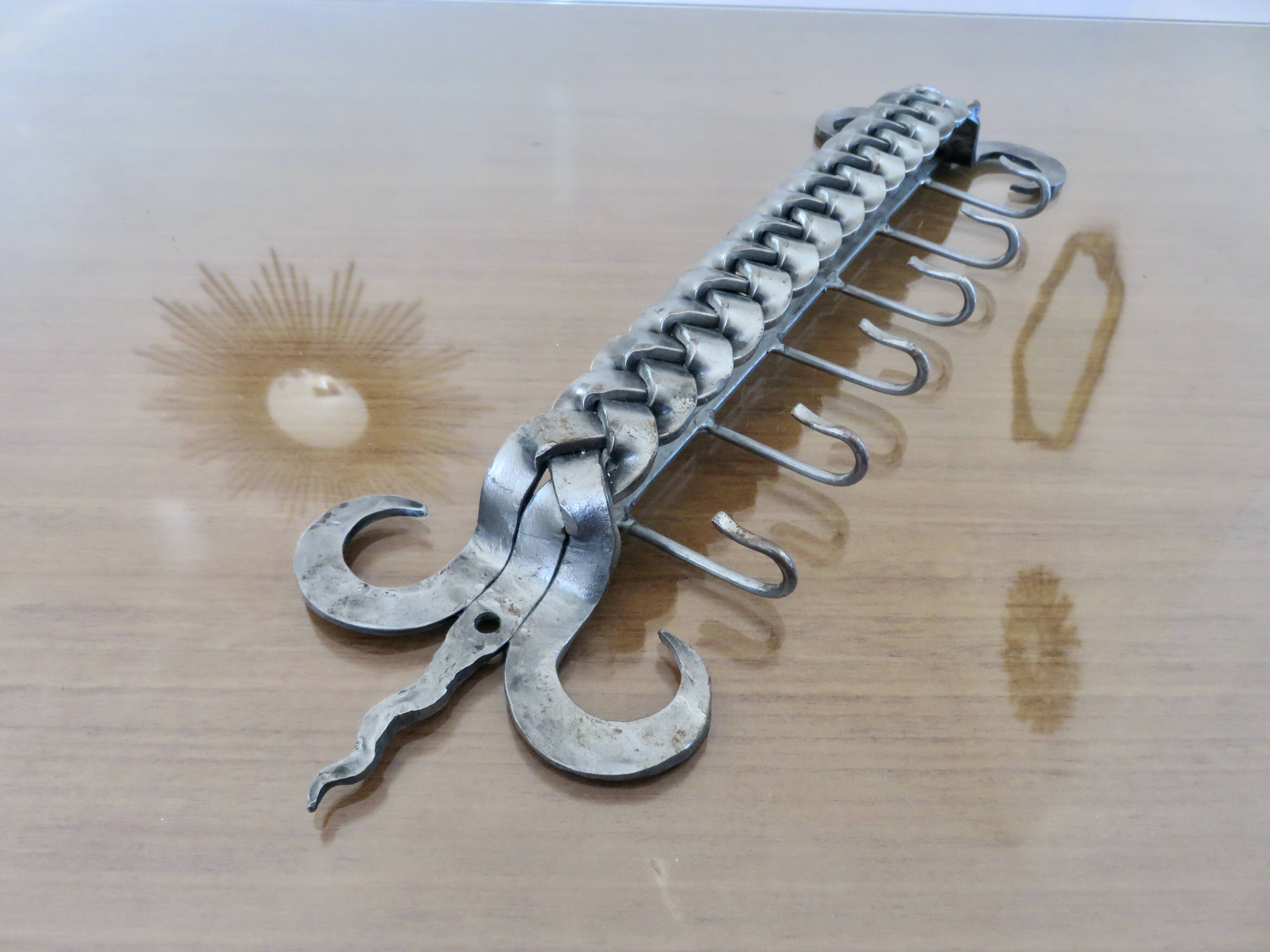 2 Tea towel holders, ironwork in braided raw steel, 1970