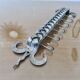 2 Tea towel holders, ironwork in braided raw steel, 1970