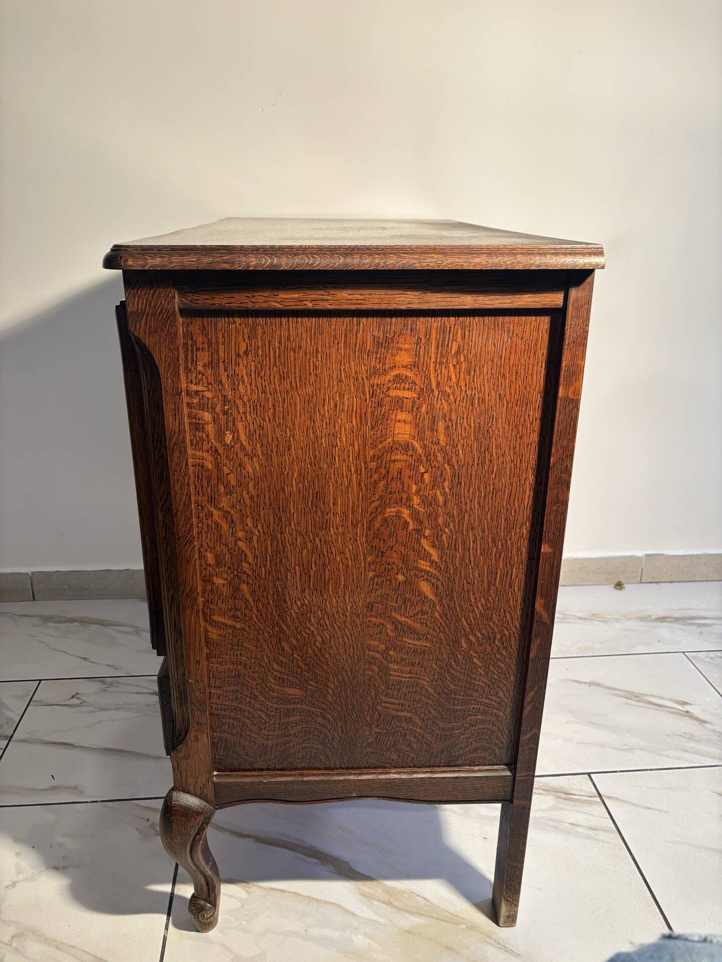 Louis XV style oak TV cabinet with drop-down flap.